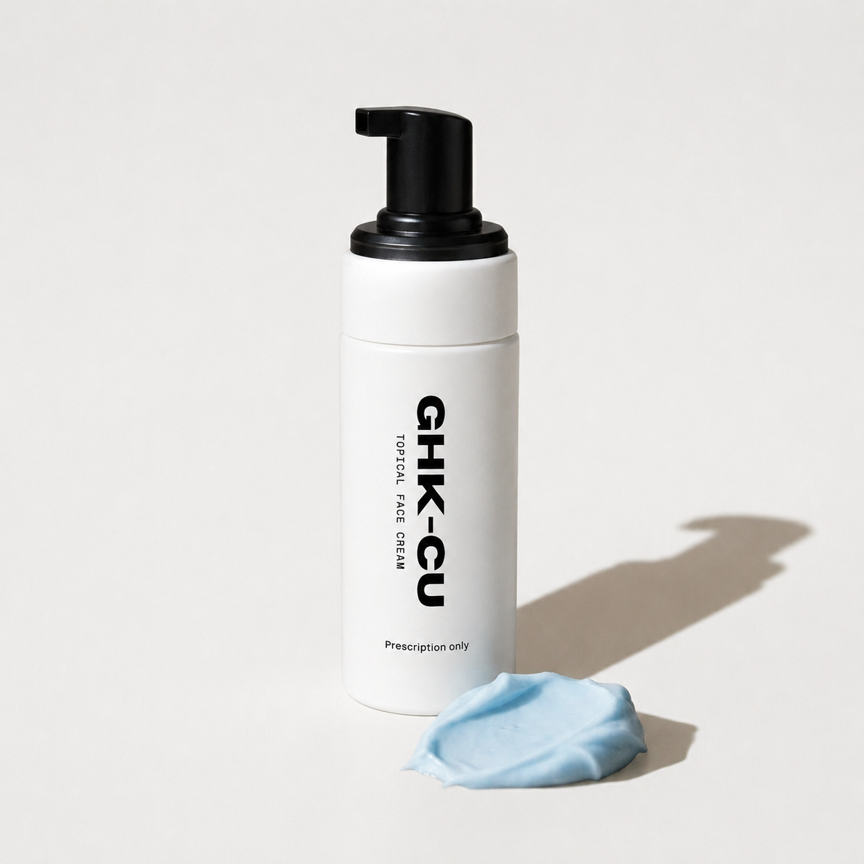 White bottle with black pump labeled &