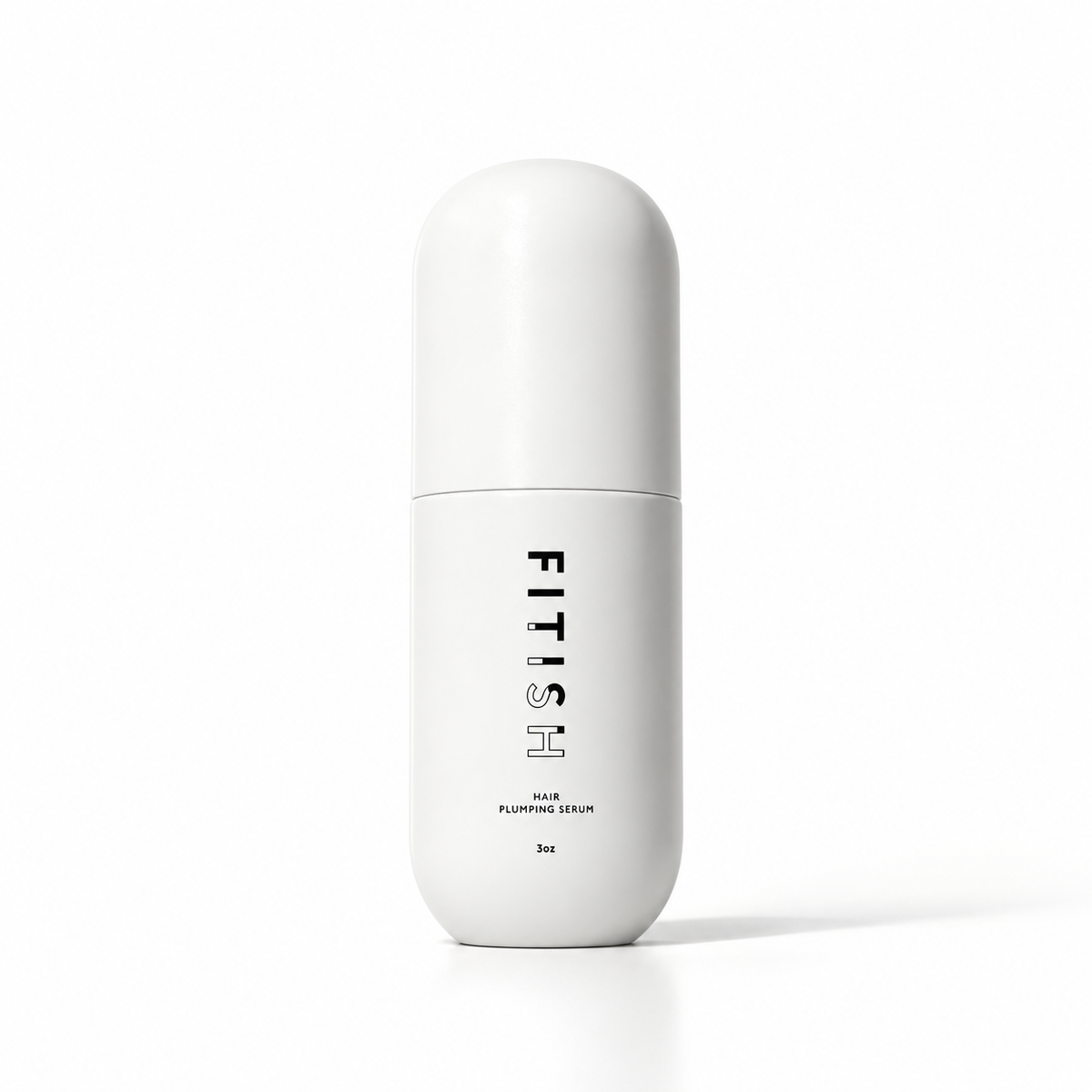Fitish Hair Plumping Serum 3 oz bottle with capsule-shaped cap on a white background