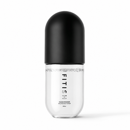 A clear cylindrical bottle with a black capsule-shaped cap, labeled FITISH Clear Winner Balancing Toner, on a clean white background.