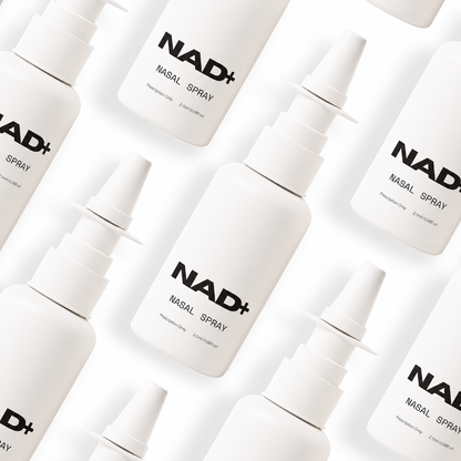 Multiple NAD+ nasal spray bottles arranged on a light background